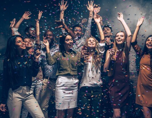 perfect_night_group_beautiful_young_people_throwing_colorful_confetti_looking_happy