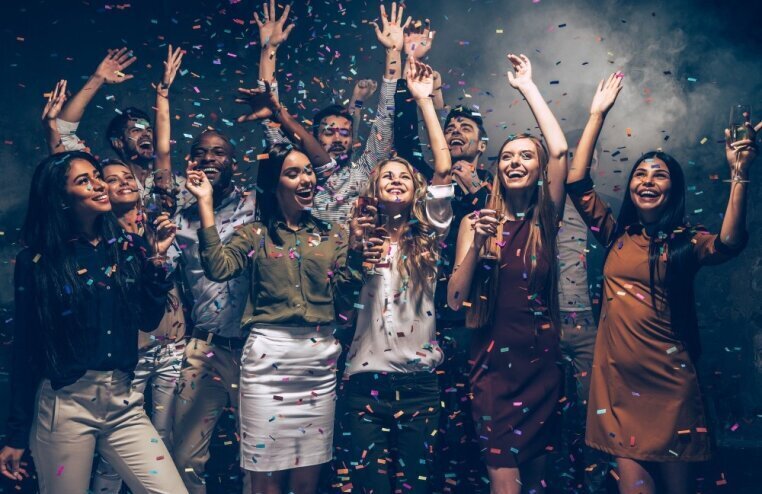perfect_night_group_beautiful_young_people_throwing_colorful_confetti_looking_happy